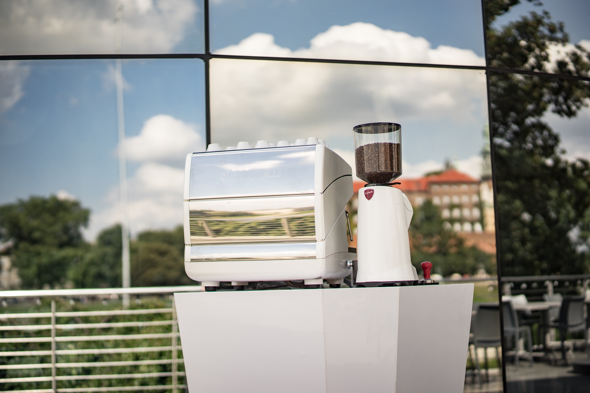 Picture of a person pouring milk into coffee cup